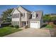 Inviting two-story home with an attached garage and mature landscaping in a peaceful neighborhood at 418 Eastway Sw Ln, Conover, NC 28613