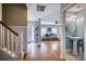 Inviting foyer with hardwood floors leads to a powder room, living room, and staircase at 418 Eastway Sw Ln, Conover, NC 28613