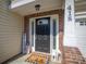 Inviting front entrance features a black front door and covered porch with patriotic decor at 418 Eastway Sw Ln, Conover, NC 28613