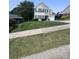 Beautiful two-story home with dark shutters, a lush lawn, and a basketball hoop at 418 Eastway Sw Ln, Conover, NC 28613