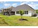 Rear exterior of the house showing the patio, hot tub, and spacious backyard at 482 Lucky Nw Dr, Concord, NC 28027