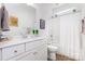 Bright bathroom featuring a white vanity, sink, and combined tub and shower at 482 Lucky Nw Dr, Concord, NC 28027