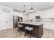 Modern kitchen with white cabinets, stainless steel appliances, granite countertops, and a center island with seating at 482 Lucky Nw Dr, Concord, NC 28027