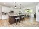 Modern kitchen with white cabinets, stainless steel appliances, granite countertops, and a center island with seating at 482 Lucky Nw Dr, Concord, NC 28027