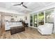 Open-concept living room with views of the kitchen, screened-in patio, and hardwood floors at 482 Lucky Nw Dr, Concord, NC 28027