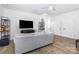 Inviting living room with modern furniture, wood flooring, and ample natural light at 482 Lucky Nw Dr, Concord, NC 28027