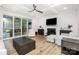 Spacious living room with coffered ceilings, a fireplace, and sliding glass doors to the patio at 482 Lucky Nw Dr, Concord, NC 28027