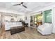 Open-concept living room with views of the kitchen, screened-in patio, and hardwood floors at 482 Lucky Nw Dr, Concord, NC 28027