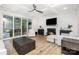 Spacious living room with coffered ceilings, a fireplace, and sliding glass doors to the patio at 482 Lucky Nw Dr, Concord, NC 28027