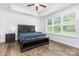 Spacious main bedroom with large window, ceiling fan and ample natural light at 482 Lucky Nw Dr, Concord, NC 28027