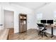 Office with a wooden desk, rolling chair, and bookshelf; natural light through the windows at 482 Lucky Nw Dr, Concord, NC 28027