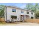 Backyard view of home featuring screened in porch and privacy fence at 514 W Cama St, Charlotte, NC 28217