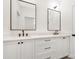 Bright bathroom features double vanities with framed mirrors and modern black hardware at 514 W Cama St, Charlotte, NC 28217