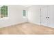 Bright room with natural light and hardwood floors. Features 2 windows and a closet door at 514 W Cama St, Charlotte, NC 28217