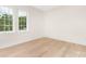 Bright bedroom featuring large windows that let in ample natural light and wood floor at 514 W Cama St, Charlotte, NC 28217