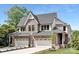 Beautiful new construction home with brick accents, attached two-car garage, and manicured landscaping at 514 W Cama St, Charlotte, NC 28217