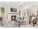 Bright living room with fireplace, wood mantel, modern furnishings, and abundant natural light at 514 W Cama St, Charlotte, NC 28217