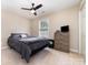 Bedroom with neutral color palette, carpet flooring, and nice window view, adjacent to a dresser at 600 Capella Ct, Gastonia, NC 28056