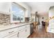 Well-lit kitchen featuring modern appliances, stylish countertops, backsplash, and a connected breakfast area at 600 Capella Ct, Gastonia, NC 28056