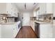 Eat-in kitchen with white cabinets, stainless appliances, granite countertops and hardwood floors at 600 Capella Ct, Gastonia, NC 28056