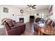Inviting living room with hardwood floors, fireplace, and comfortable seating at 600 Capella Ct, Gastonia, NC 28056