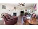 Inviting living room with hardwood floors, fireplace, and comfortable seating at 600 Capella Ct, Gastonia, NC 28056