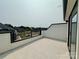 Spacious balcony with dark metal railing, offering neighborhood views at 6013 Countess Dr # 51, Charlotte, NC 28217