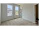 Bright bedroom featuring neutral paint color, plush carpet, and natural light at 6013 Countess Dr # 51, Charlotte, NC 28217