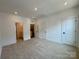 Well-lit bedroom featuring neutral paint color, plush carpet, and two closets at 6013 Countess Dr # 51, Charlotte, NC 28217