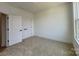 Bedroom featuring plush carpet, neutral paint color, natural light, and closet at 6013 Countess Dr # 51, Charlotte, NC 28217