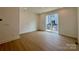 Bright living room featuring modern recessed lighting, neutral paint colors, and sliding glass door at 6013 Countess Dr # 51, Charlotte, NC 28217