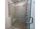 Modern shower featuring neutral paint color, bench, and glass door at 6013 Countess Dr # 51, Charlotte, NC 28217