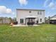 Spacious backyard featuring a patio area with gazebo and a privacy fence at 6017 Fazio Ct, Harrisburg, NC 28075