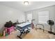 Versatile bedroom with exercise equipment and toys, offering space for various activities at 6017 Fazio Ct, Harrisburg, NC 28075