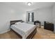 Bedroom featuring neutral paint, carpet, ceiling fan, and gray curtains at 6017 Fazio Ct, Harrisburg, NC 28075