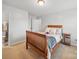 Bright bedroom with a wooden bed frame, neutral-colored carpet and access to an ensuite bathroom at 6017 Fazio Ct, Harrisburg, NC 28075