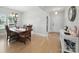 Charming dining area featuring a wooden table, stylish chairs, and natural light from a window at 6017 Fazio Ct, Harrisburg, NC 28075