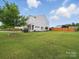 Traditional two-story home with manicured lawn and landscaping at 6017 Fazio Ct, Harrisburg, NC 28075