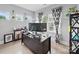 Cozy home office with modern desk setup, stylish patterned curtains, and ambient natural light at 6017 Fazio Ct, Harrisburg, NC 28075