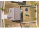 Aerial view showcasing the backyard, complete with a playground set and trampoline, enclosed by a fence at 7172 Teague Dr, Gastonia, NC 28056