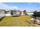Backyard featuring a playset, grill and trampoline, and white fence at 7172 Teague Dr, Gastonia, NC 28056