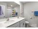 Neutral bathroom featuring a double sink vanity and framed mirror, with a shower tub combination at 7172 Teague Dr, Gastonia, NC 28056