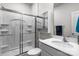 Bathroom with a shower and tub, white cabinet and shower doors at 7172 Teague Dr, Gastonia, NC 28056