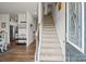 Open entryway featuring a staircase, hardwood floors, and a view into the living spaces at 7172 Teague Dr, Gastonia, NC 28056