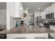Spacious kitchen with granite countertops, stainless steel appliances, and white cabinetry, perfect for cooking and entertaining at 7172 Teague Dr, Gastonia, NC 28056