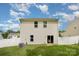 Well-maintained backyard features a white fence, an AC unit, and lush green grass at 7209 Cuddington Dr, Charlotte, NC 28215