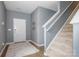 Inviting entryway with a staircase, neutral decor, and a patterned rug for a cozy welcome at 7209 Cuddington Dr, Charlotte, NC 28215