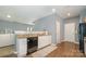 Efficient kitchen layout with granite countertops, a dishwasher, and access to the living area at 7209 Cuddington Dr, Charlotte, NC 28215