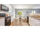 Well-appointed kitchen with granite countertops, stainless steel appliances, and a view of the dining area at 7209 Cuddington Dr, Charlotte, NC 28215