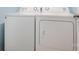 The laundry room features a white Amana brand washing machine and dryer at 7209 Cuddington Dr, Charlotte, NC 28215